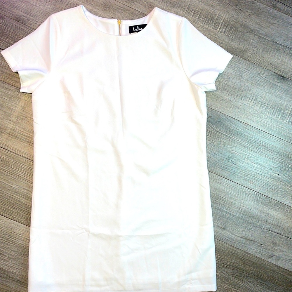 All white dress with an extra layer underneath